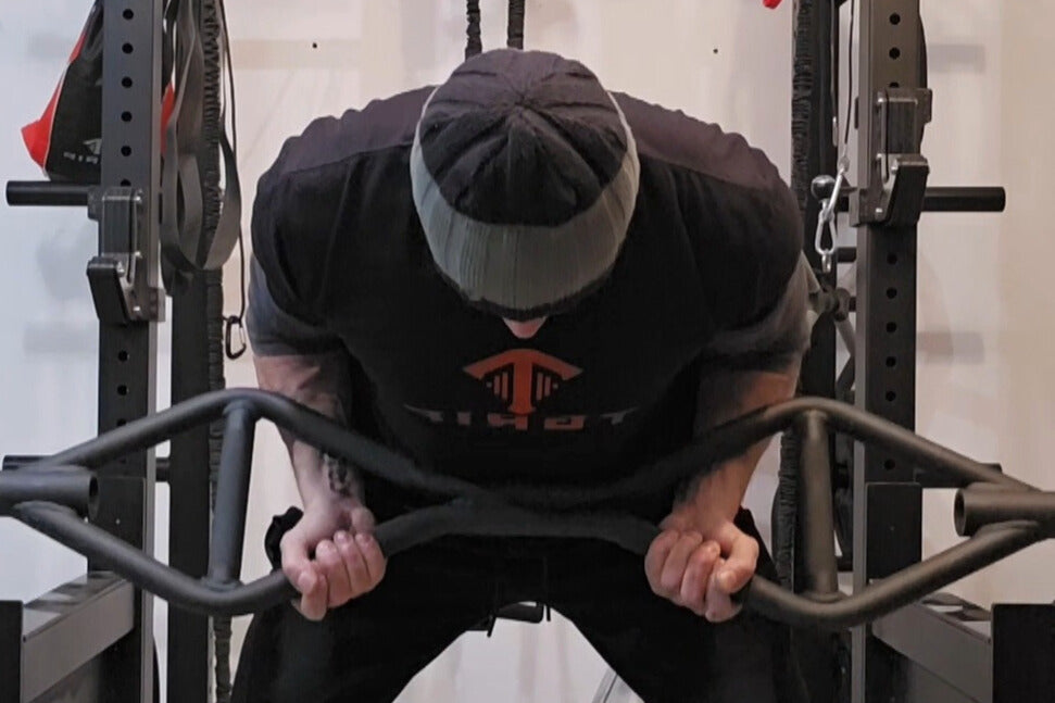 Tim, the creator of Tgrip bars, performing an underhand row with a Tgrip bar, demonstrating proper form for back training.